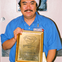 Steven Kanzaki displays his award which includes a gift certificate to Tower Records. 